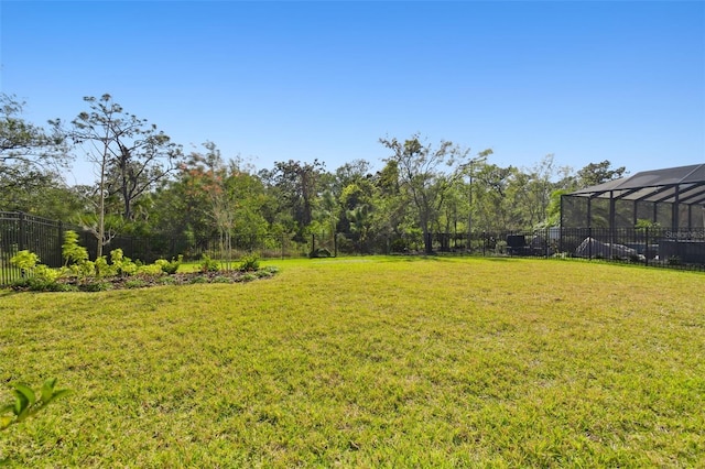 view of yard featuring a lanai