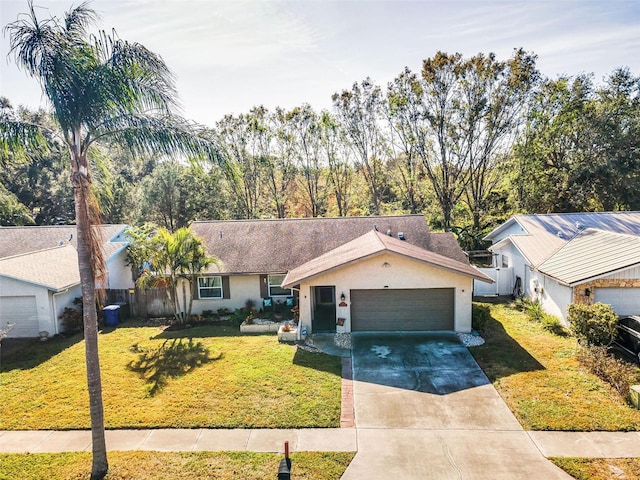 ranch-style house featuring a front yard and a garage