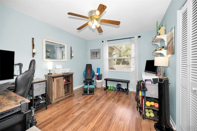 office area with ceiling fan, a textured ceiling, and light wood-type flooring