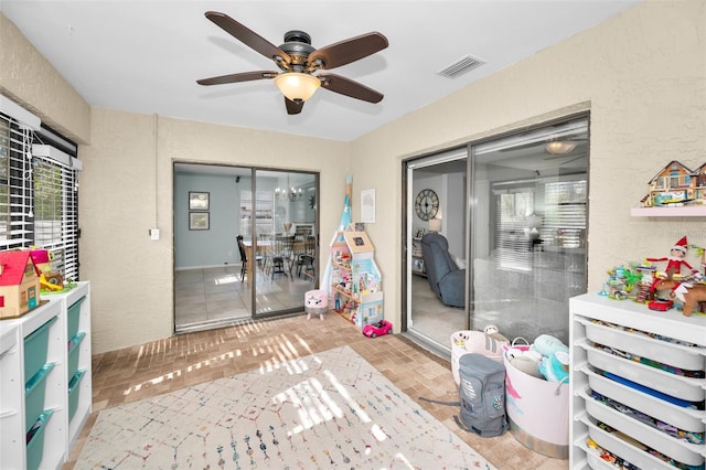 playroom featuring ceiling fan