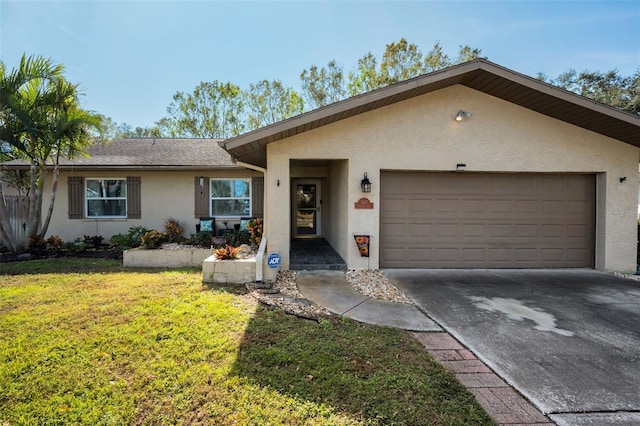 ranch-style house featuring a front yard and a garage