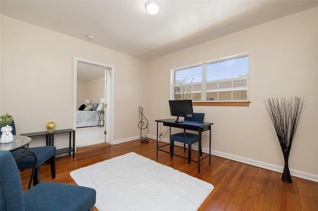 office featuring wood finished floors and baseboards