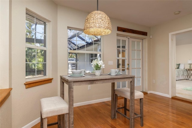 office space with wood finished floors and baseboards