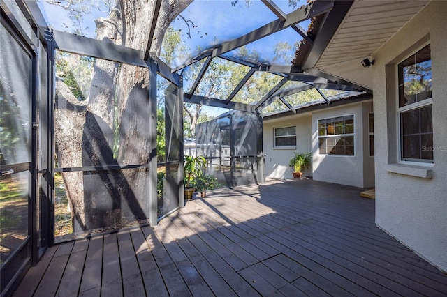 wooden terrace featuring glass enclosure