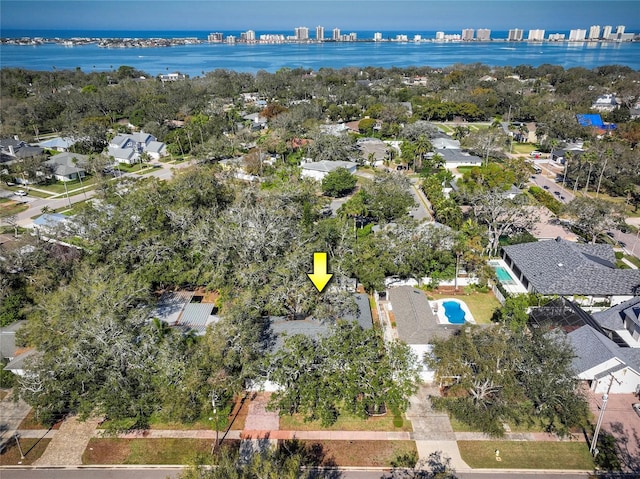 birds eye view of property with a water view