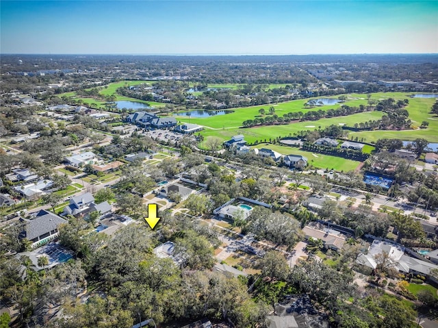 bird's eye view featuring view of golf course and a water view