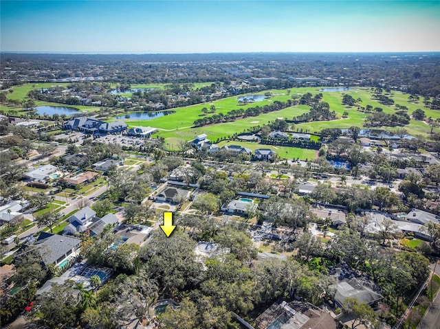 bird's eye view featuring golf course view and a water view