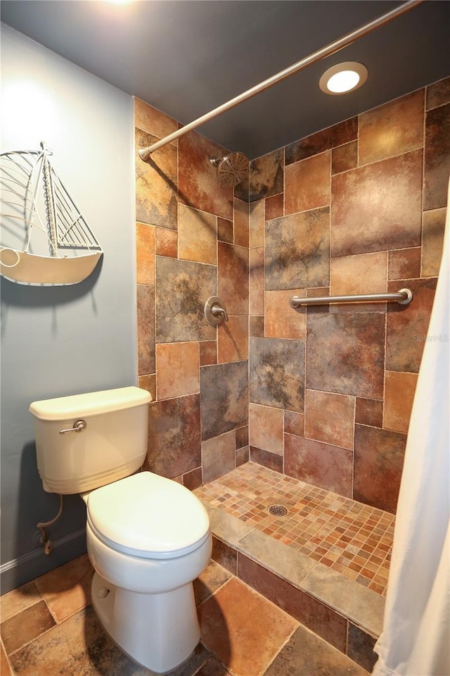 bathroom with a shower with curtain and toilet