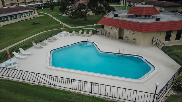 view of swimming pool with a patio