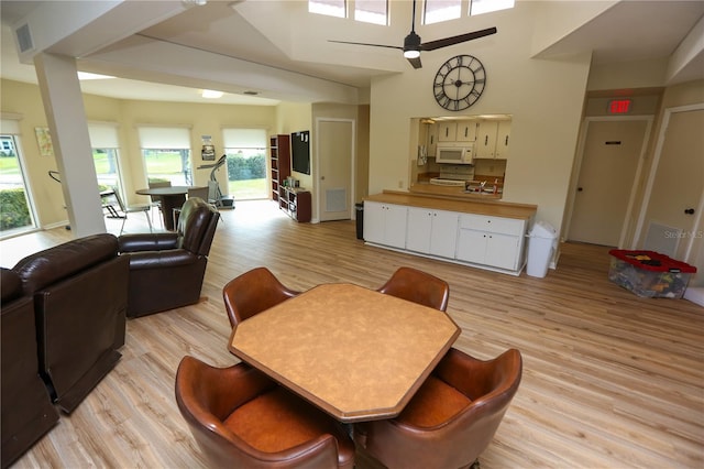 dining room with light wood-type flooring and ceiling fan