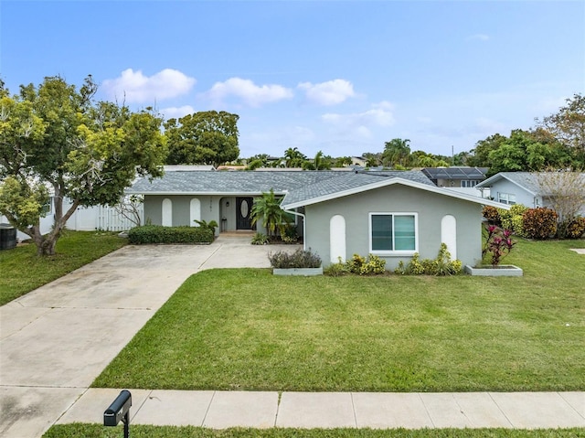 single story home featuring a front yard