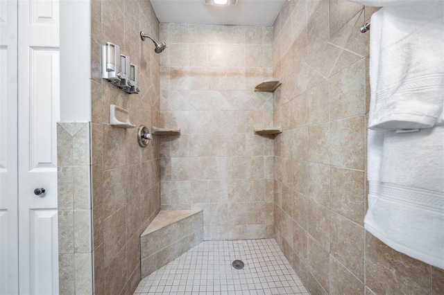 bathroom featuring tiled shower