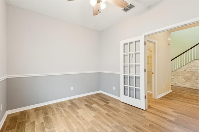 unfurnished room with ceiling fan and light hardwood / wood-style flooring