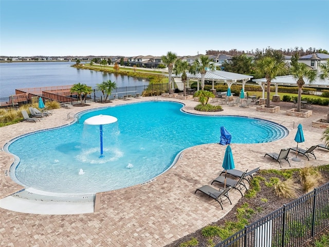 view of pool with a gazebo, a water view, and a patio