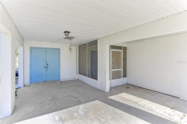 doorway to property with a patio