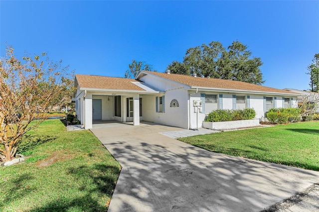 ranch-style home featuring a front yard