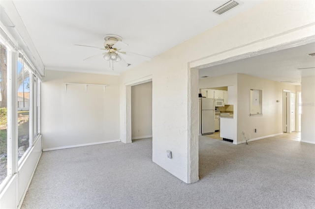 spare room with ceiling fan