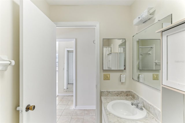 bathroom featuring tile patterned flooring and vanity