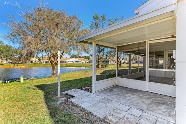 unfurnished sunroom with a water view