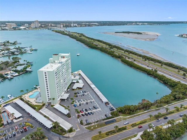 bird's eye view with a water view and a beach view