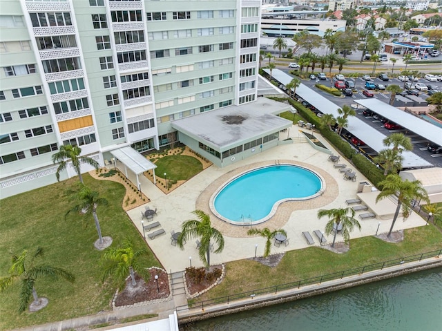 view of swimming pool with a water view