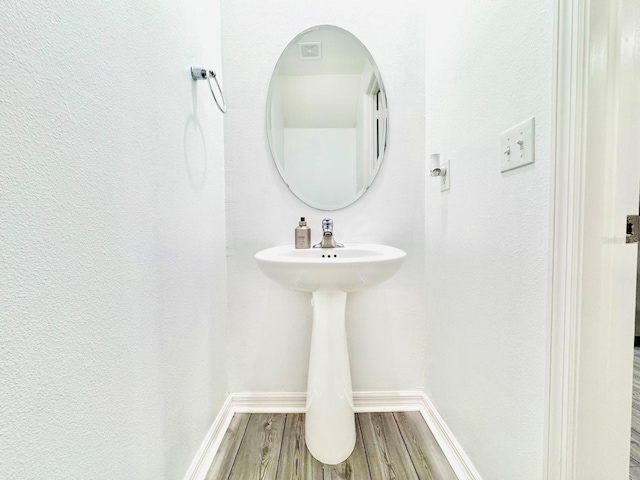 bathroom featuring wood-type flooring