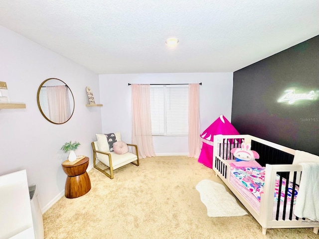 bedroom with carpet floors and a textured ceiling