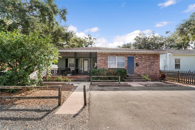 view of front of property featuring covered porch