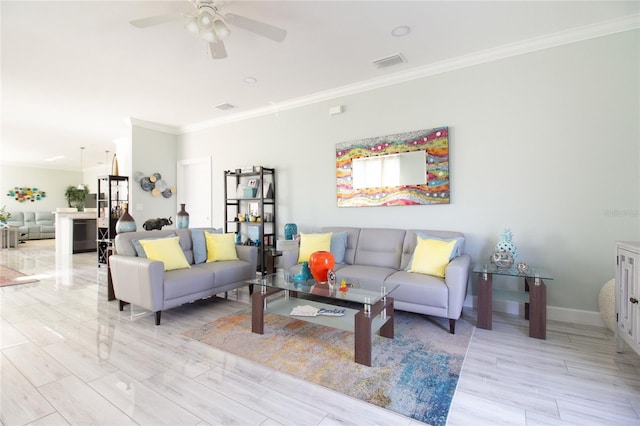 living room featuring ceiling fan and crown molding