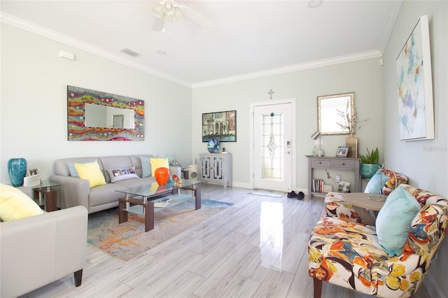 living room with ceiling fan, light hardwood / wood-style flooring, and ornamental molding