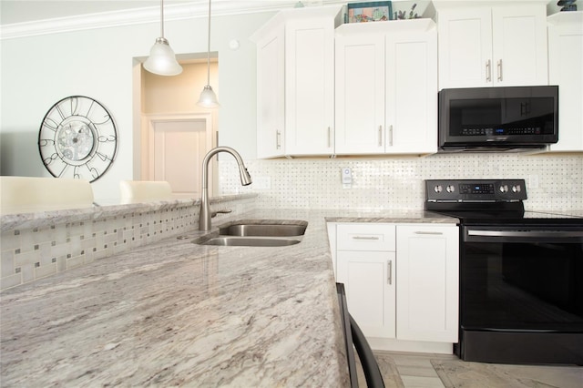 kitchen featuring sink, light stone countertops, black range with electric cooktop, decorative light fixtures, and white cabinetry