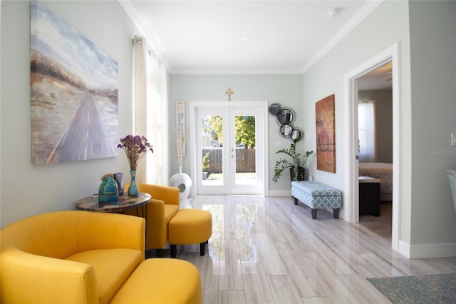 living area featuring french doors, light wood-type flooring, and crown molding