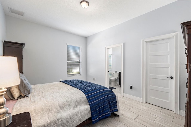 bedroom with ensuite bath