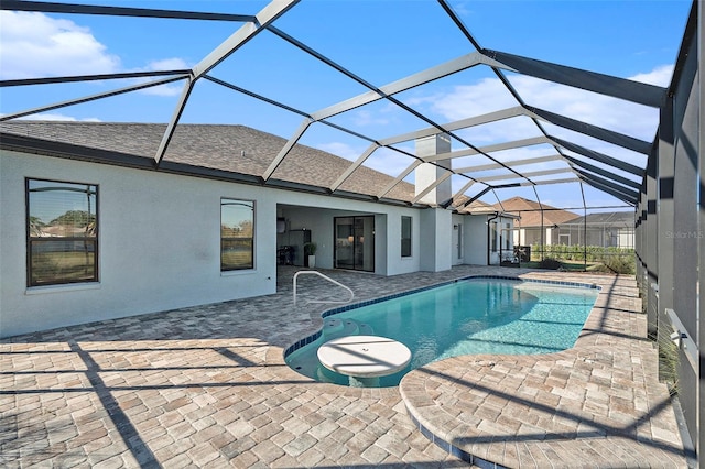 view of pool featuring a lanai and a patio area