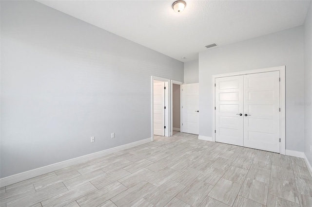 unfurnished bedroom featuring a closet