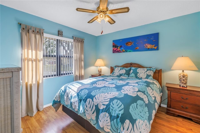 bedroom featuring ceiling fan and light hardwood / wood-style floors