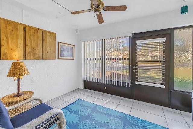 interior space featuring ceiling fan