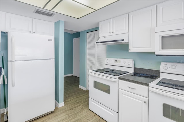 kitchen featuring light wood-type flooring, white cabinetry, and white appliances