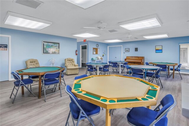 game room featuring ceiling fan and light wood-type flooring