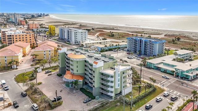 bird's eye view featuring a water view and a view of the beach