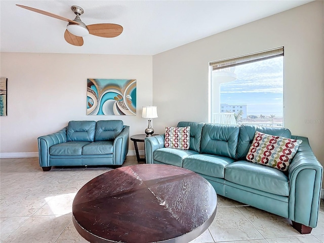 living room featuring ceiling fan and light tile patterned flooring