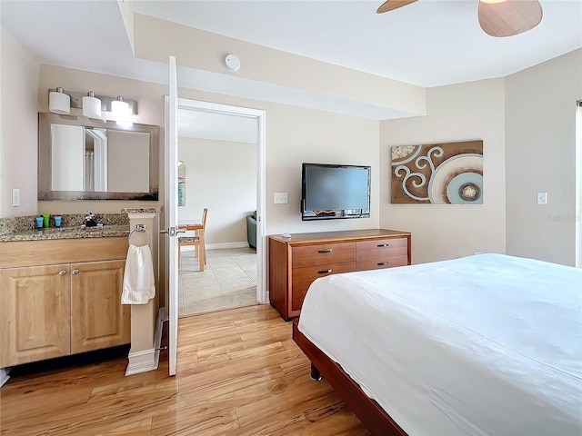 bedroom with light wood-type flooring and ceiling fan