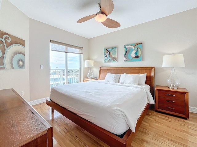 bedroom featuring ceiling fan, access to outside, and light hardwood / wood-style flooring