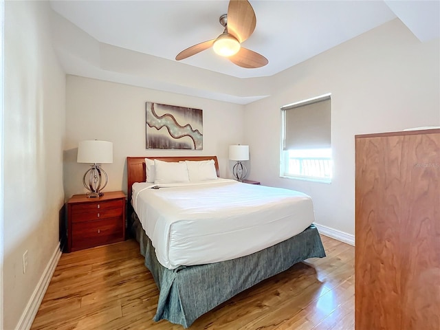 bedroom featuring ceiling fan and light hardwood / wood-style floors