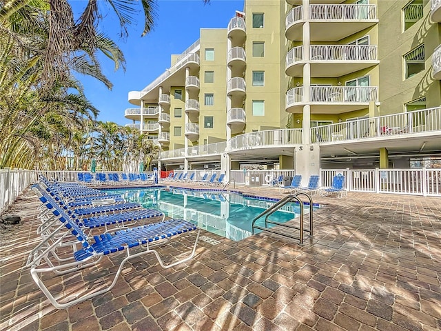 view of swimming pool featuring a patio area