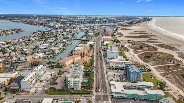 birds eye view of property with a view of the beach and a water view