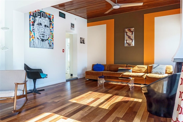 living room featuring wood ceiling, wood finished floors, visible vents, and baseboards