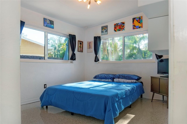 bedroom with speckled floor