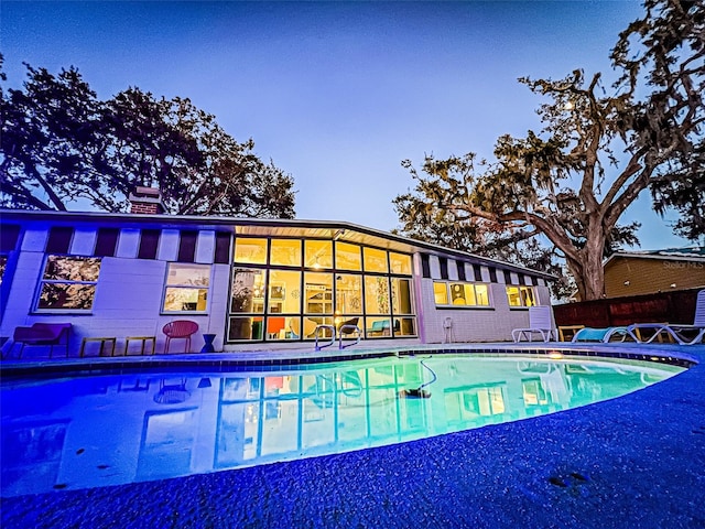 view of pool featuring a fenced in pool and a patio