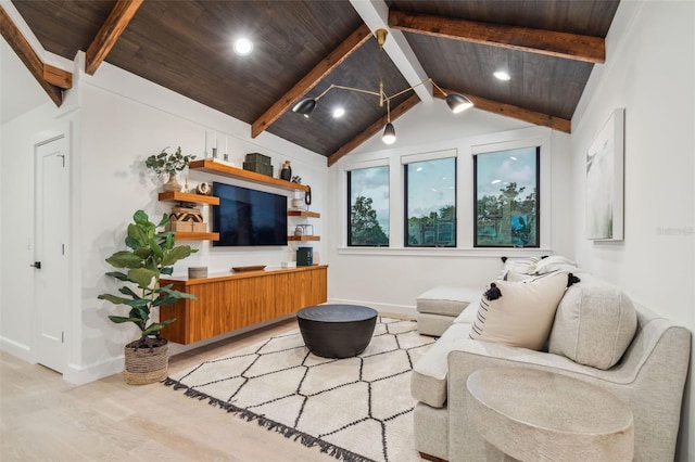 living room with lofted ceiling with beams, light hardwood / wood-style floors, and wood ceiling